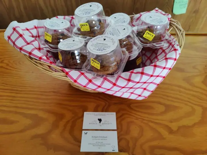 Basket of muffins for sale at Little Red Barn farmers market